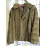 Ladies pale fur type jacket.