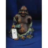 Oriental porcelain figure of a seated laughing Buddha.  CONDITION REPORT; No obvious damage.
8 1/