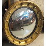 Gilt circular convex mirror.