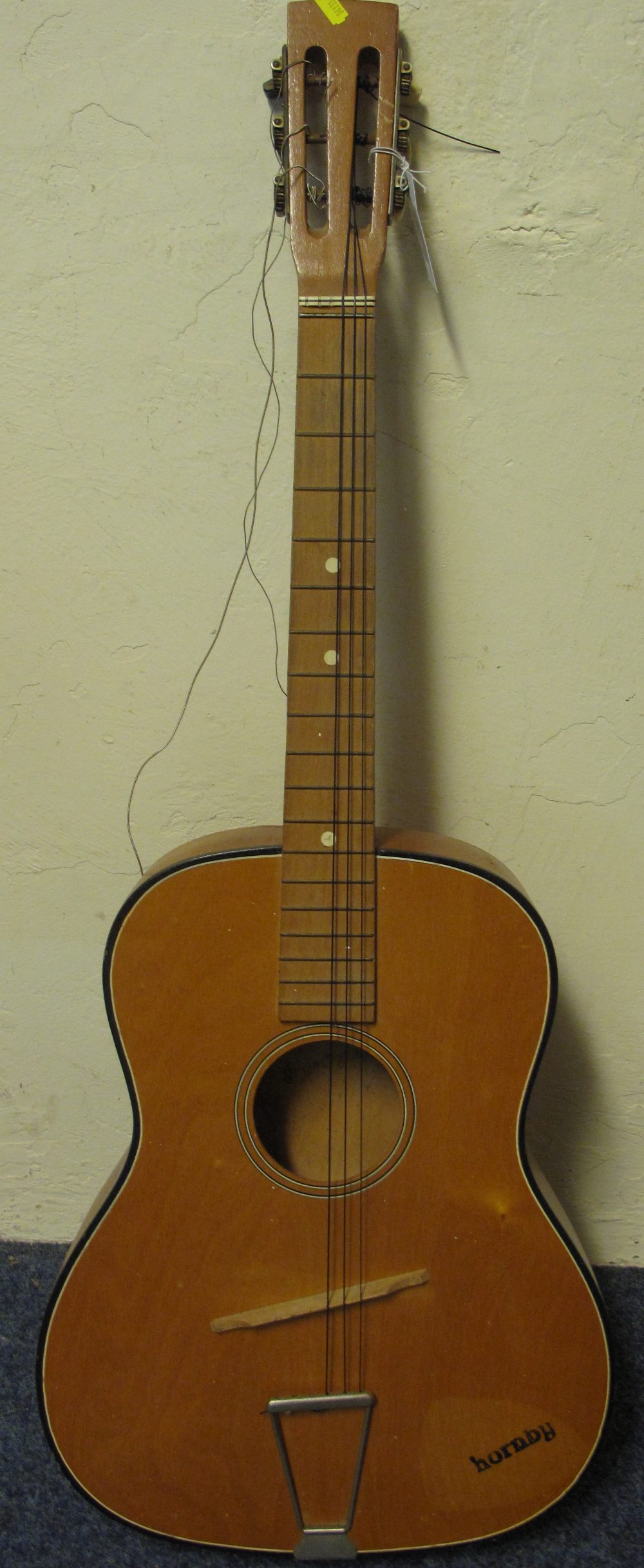 Hornby six string acoustic guitar.