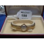 Rodania 9ct gold ladies wrist watch in original box.  CONDITION REPORT; The lock mechanisms are