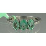 AN 18CT WHITE GOLD THREE STONE EMERALD R