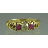 A 18CT GOLD RUBY AND DIAMOND THREE STONE