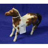 Beswick china small skewbald pony foal.  CONDITION REPORT: Item is crazed but appears undamaged.