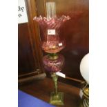 Brass double burner oil lamp with writhe