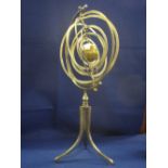 Modern steel and brass Orrery on three legged tri form base.