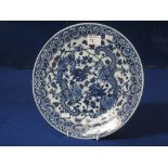 Chinese porcelain blue and white plate decorated with scaly dragons amongst foliage and with reverse