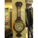 Early 20th Century carved oak presentation aneroid wheel barometer.