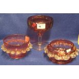 Three items of cranberry glass to include two petalled bowls and a pedestal bonbon dish.  (3)