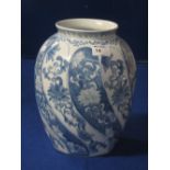 An Oriental blue and white porcelain, ovoid shaped vase with wrythen foliate decoration.