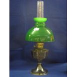 Plated pedestal oil lamp with coloured over-lay glass shade and clear chimney.