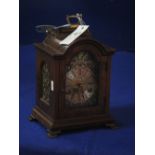 Reproduction walnut cased Georgian style two train bracket clock with rolling moon.