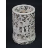 CHINESE CARVED IVORY CYLINDRICAL PIERCED NIGHT LIGHT HOLDER overall decorated with figures and