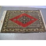 20th CENTURY MIDDLE EASTERN RED GROUND GEOMETRIC AND FOLIATE DECORATED RUG OR WALL HANGING with