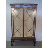 GEORGIAN STYLE MAHOGANY ASTRAGAL GLAZED TWO DOOR CHINA DISPLAY CABINET with dentil drop finial
