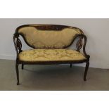 EARLY 20TH CENTURY INLAID MAHOGANY UPHOLSTERED SOFA, having pierced splats and swept arms with
