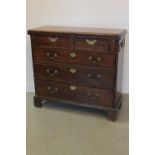 18th CENTURY MAHOGANY STRAIGHT FRONTED BACHELOR'S CHEST OF DRAWERS having fold over moulded