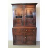 EARLY 19th CENTURY WELSH OAK AND PINE TWO STAGE FOOD CUPBOARD having moulded cornice over two