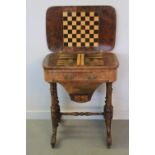 VICTORIAN INLAID WALNUT GAMES AND WORK TABLE having foliate inlaid and strung top opening to