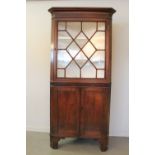 19th CENTURY WELSH OAK TWO STAGE DOUBLE CORNER CABINET having moulded cornice over single astrogal
