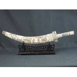 LATE 19th/EARLY 20th CENTURY JAPANESE IVORY DECORATIVE SHORT SWORD, TANTO, in heavily carved tusk