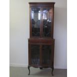 EDWARDIAN INLAID MAHOGANY TWO STAGE STANDING CORNER CABINET having moulded cornice over a pair of