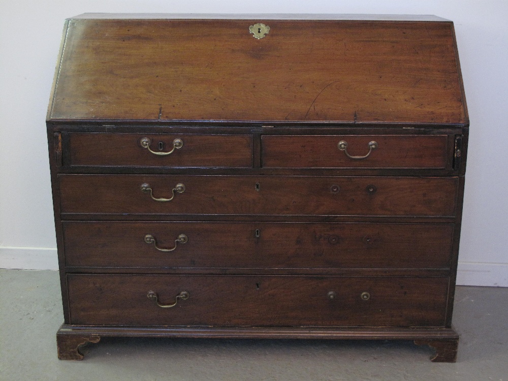 LATE GEORGIAN MAHOGANY FALL FRONT BUREAU, moulded edge fall revealing break fronted interior with