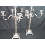 PAIR OF MAPPIN AND WEBB SILVER PLATED FOUR BRANCH CORINTHIAN COLUMN CANDELABRA raised on square