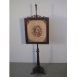 19th CENTURY ROSEWOOD POLE SCREEN having needlepoint foliate banner, faceted pedestal on petal