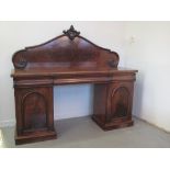 VICTORIAN MAHOGANY TWIN PEDESTAL SIDEBOARD having foliate moulded arched back over three frieze