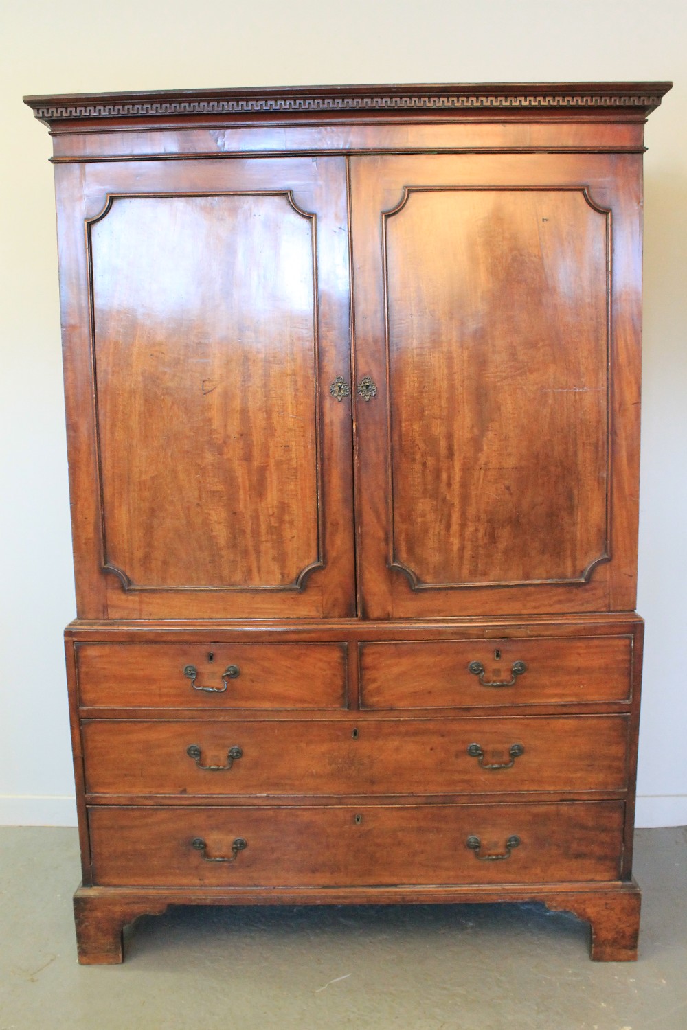 GEORGIAN MAHOGANY TWO STAGE PRESS CUPBOARD on bracket feet.  49" x 25" x 72.5" (125 x 64 x 184cm)