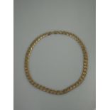 A 9CT GOLD FLATTENED CURB LINK CHAIN.  Length 20" (51cm) Weight 75.9g CONDITION REPORT: In good