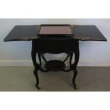 LATE VICTORIAN EBONIZED BARKERS PATENT SERPENTINE SHAPED OPENING COCKTAIL TABLE with lift out tray