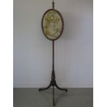 EARLY 19th CENTURY MAHOGANY SATIN WOOD BANDED POLE SCREEN having oval bvanner with silk needlework