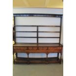 LATE 18th CENTURY WELSH OAK FOUR DRAWER POT BOARD DRESSER having three shelf open rack back over