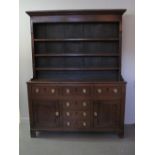 EARLY 19th CENTURY NORTH WALES OAK RACK BACK DRESSER,  with boarded rack having moulded cornice over