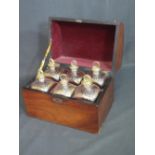 19th CENTURY MAHOGANY PIANO FRONT DECANTER BOX, the interior revealing six compartments and gilt