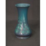 EARLY 20th CENTURY RUSKIN POTTERY WAISTED VASE decorated with ivy on a purple, green, blue souffle