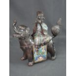 CHINESE BRONZED CHAMPLEVE ENAMEL FIGURE GROUP depicting a dog of Fo with a deity figure playing a