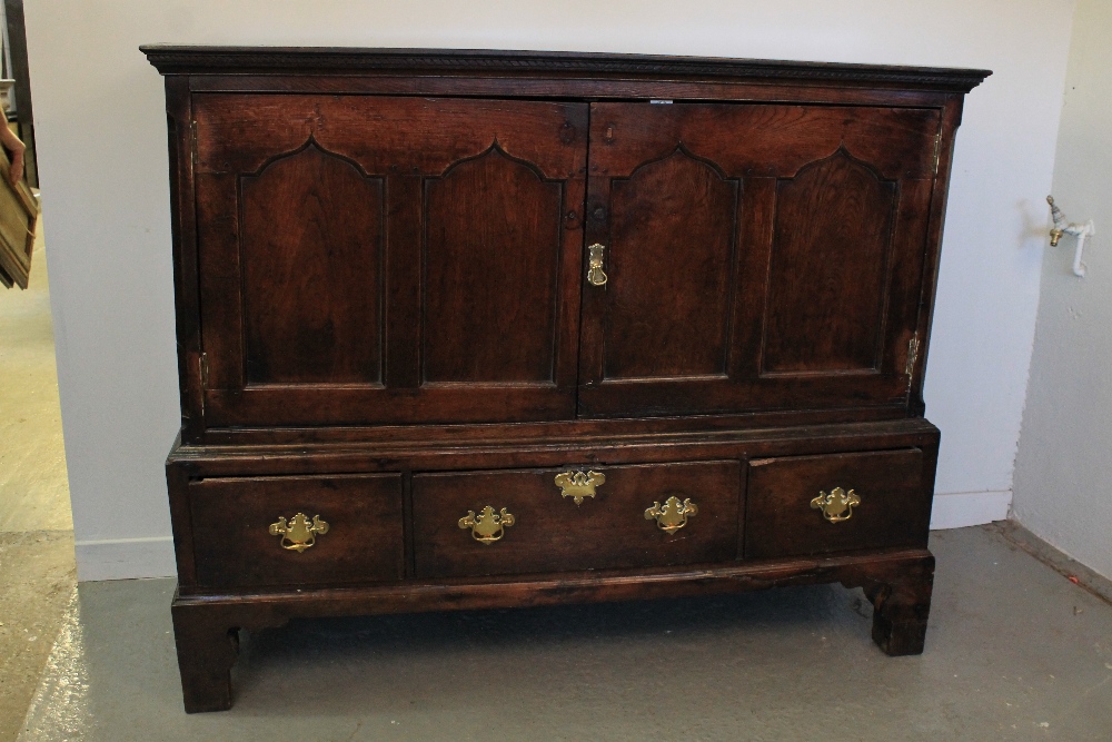 18th CENTURY WELSH OAK LOW PRESS CUPBOARD having moulded cornice over two ogee pointed arch panel