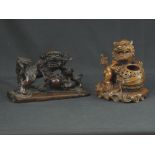 TWO CHINESE CARVED WOODEN DOGS OF FO GROUPS, one showing two dogs, one with the dog resting on a