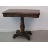19th CENTURY ROSEWOOD FOLD OVER PEDESTAL TEA TABLE having moulded edge top with curved angles