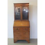 EDWARDIAN INLAID MAHOGANY BUREAU BOOKCASE of small proportions having moulded cornice over cross