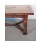 17th CENTURY STYLE OAK DRAW LEAF EXTENDING DINING TABLE having cleated top and leaves above arcade