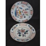 TWO 18th CENTURY ENGLISH DELFT POTTERY HAND-PAINTED PLATES decorated with birds and foliage.  13"