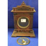 Early 20th Century architectural mahogany mantle clock lacking face and movement.