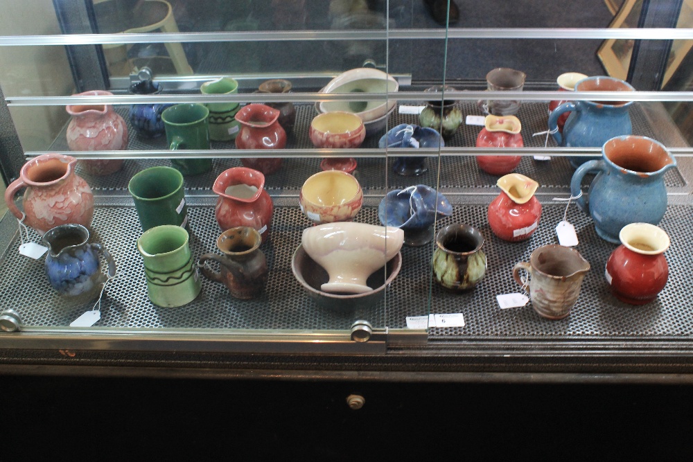 Quantity of assorted Ewenny pottery items to include baluster jugs, squat vases,