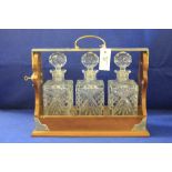 Three section decanter with silver plated mounts marked PB & S with three clear glass decanters and