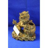 20th Century Chinese carved dog of Fo, the dog resting on a pierced basket.