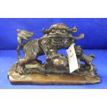 20th Century Chinese carved wooden dog of Fo group depicting two dogs on rectangular plinth.